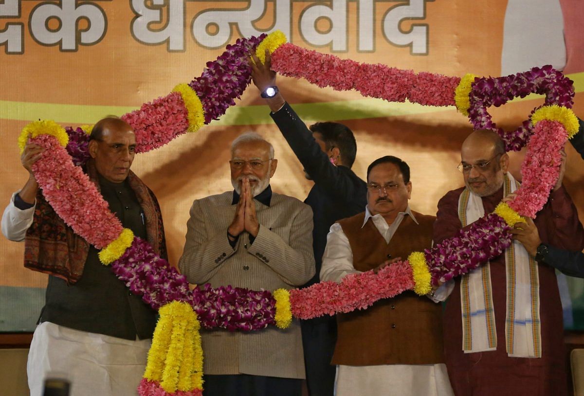 From left: Defence Minister Rajnath Singh, PM Modi, Nadda and Home Minister Amit Shah being garlanded at the BJP headquarters | Photo: Manisha Mondal | ThePrint