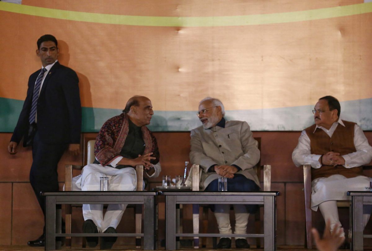 Rajnath Singh and PM Modi talk, as Nadda looks on | Photo: Manisha Mondal | ThePrint