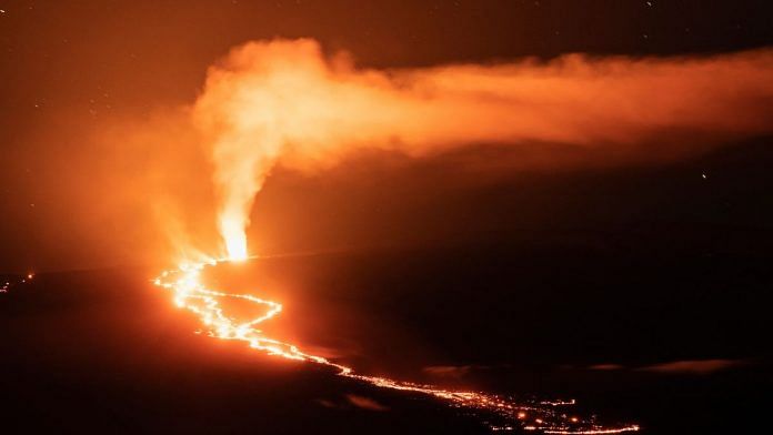 Lava fountains and flows illuminate the area with a glow at the Mauna Loa volcano eruption in Hawaii, US on 2 December, 2022 | Reuters/Go Nakamura