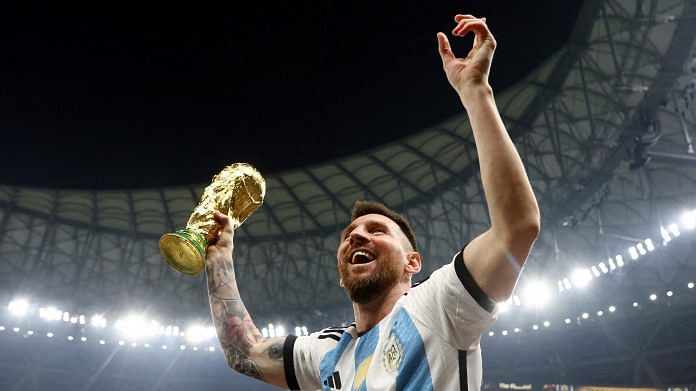 Argentina's Lionel Messi celebrates winning the World Cup with the trophy at Lusail Stadium in Qatar on 18 December 2022 | Photo: Reuters /Hannah Mckay