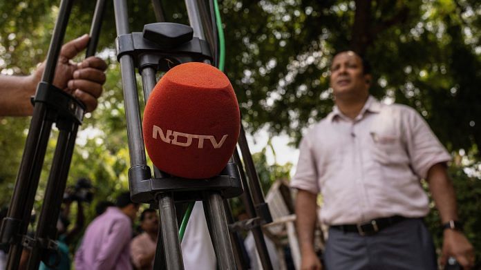 File photo of a microphone of New Delhi Television (NDTV) is placed along a roadside in New Delhi on 26 August, 2022 | Reuters