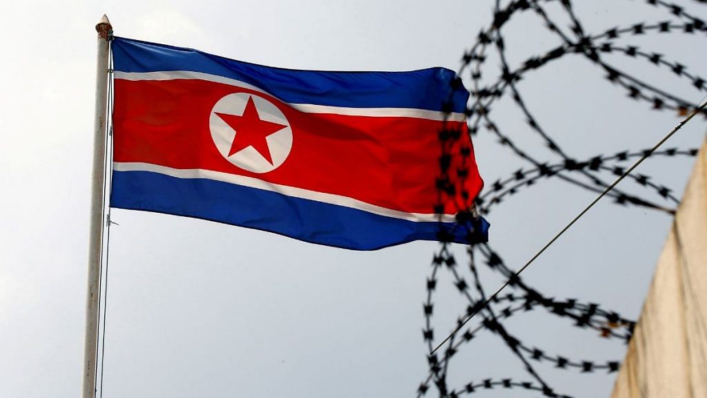 File photo of a North Korea flag flutters next to concertina wire at the North Korean embassy in Kuala Lumpur, Malaysia | Reuters/Edgar Su