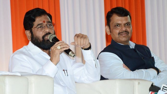 Maharashtra Chief Minister Eknath Shinde speaks as Deputy Chief Minister Devendra Fadnavis looks on during a press conference on the eve of the Maharashtra Assembly's Winter Session in Nagpur | ANI