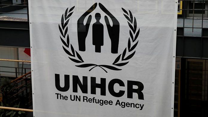 A logo is pictured on a banner at the UNHCR headquarters in Geneva, Switzerland | Reuters/Denis Balibouse