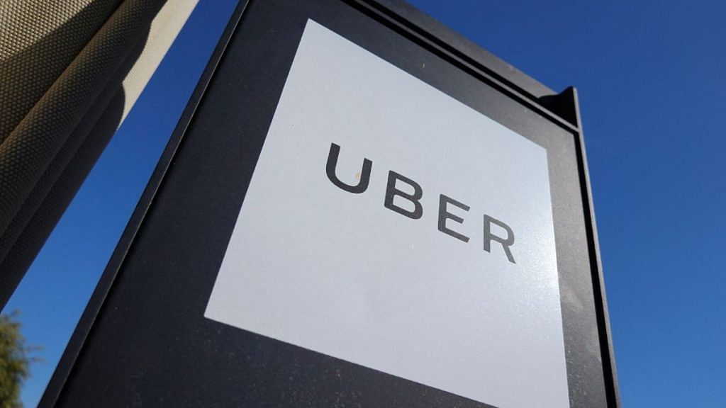 An Uber sign is seen at a shopping mall | Reuters/Mike Blake/File Photo