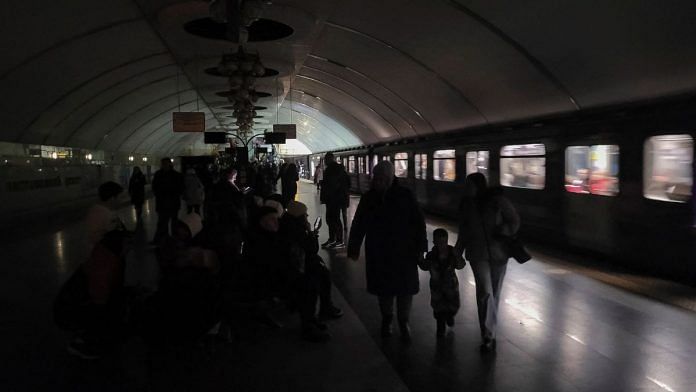 People shelter inside a metro station during partial power outage amid massive Russia's missile attacks in Kyiv, Ukraine | Reuters/Pavlo Podufalov