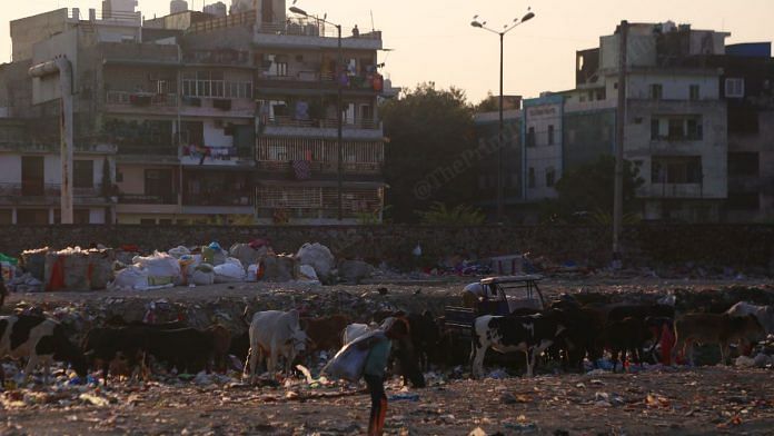 The colony is situated on a barren land, where people also dump waste | Manisha Mondal, ThePrint
