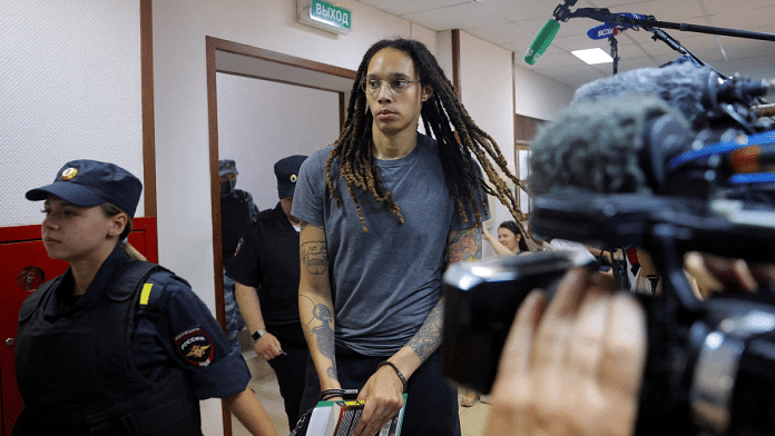 US basketball player Brittney Griner is escorted before the verdict in Khimki outside Moscow, Russia | Reuters/Evgenia Novozhenina/Pool/File Photo