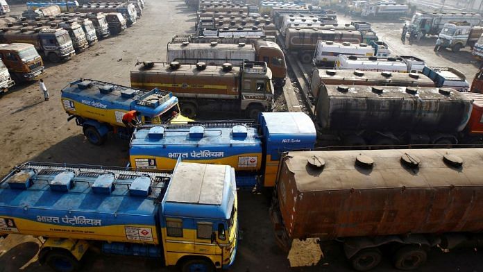 File photo of oil tankers seen parked at a yard outside a fuel depot on the outskirts of Kolkata on 3 February, 2015 | Reuters