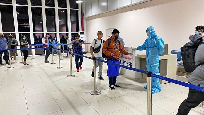Passengers undergo thermal screening at the airport amid surge in the Covid-19 cases across the world, on Monday at Indira Gandhi International Airport