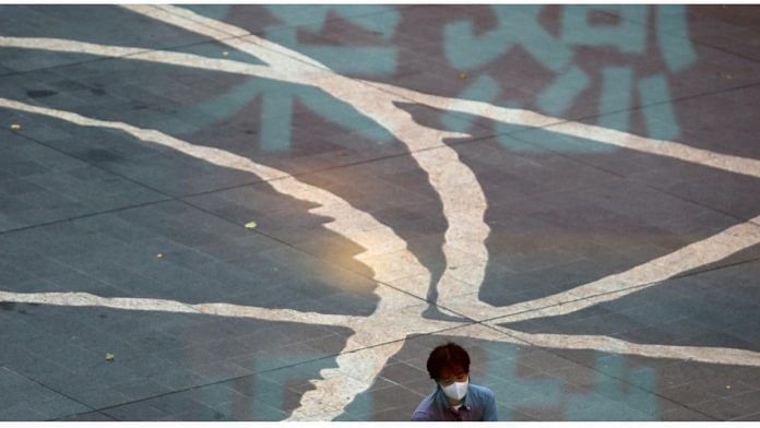 File photo of a part of a sign with safety measures is seen reflected in a window, amid the coronavirus disease outbreak, in Tokyo, Japan on 10 September, 2020 | Reuters