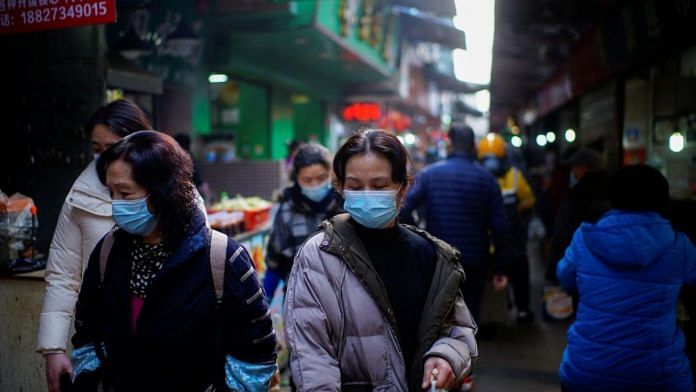 Representative image | People wearing face masks walk on a street market, following an outbreak of the coronavirus disease (COVID-19) in Wuhan, Hubei province, China February 8, 2021 | Aly Song, Reuters