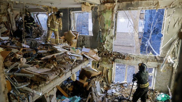Rescuers remove debris inside destroyed apartments of a residential building hit by shelling in the course of Russia-Ukraine conflict in Donetsk, Russian-controlled Ukraine | Reuters/Alexander Ermochenko