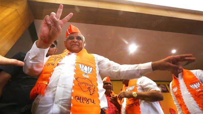 Gujarat CM Bhupendra Patel flashes the victory sign as the BJP sweeps Gujarat | Photo: Praveen Jain | ThePrint