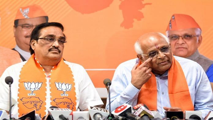 Gujarat caretaker chief minister Bhupendra Patel addresses a press conference with BJP state chief C R Patil after attending the newly-elected BJP MLAs' meeting, at the party office, in Gandhinagar on Saturday | ANI