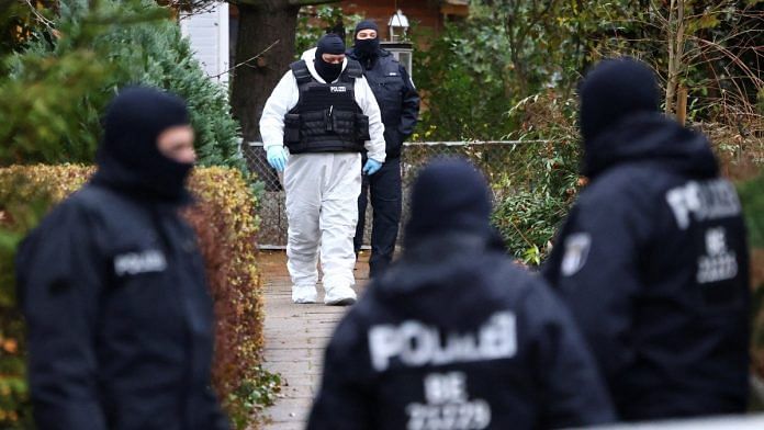 Police secures the area after suspected members and supporters of a far-right group were detained during raids across in Berlin, on 7 December 2022 | Reuters/Christian Mang