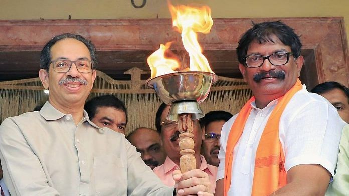 File photo of Uddhav Thackeray being handed the mashaal by the Election Commission | ANI