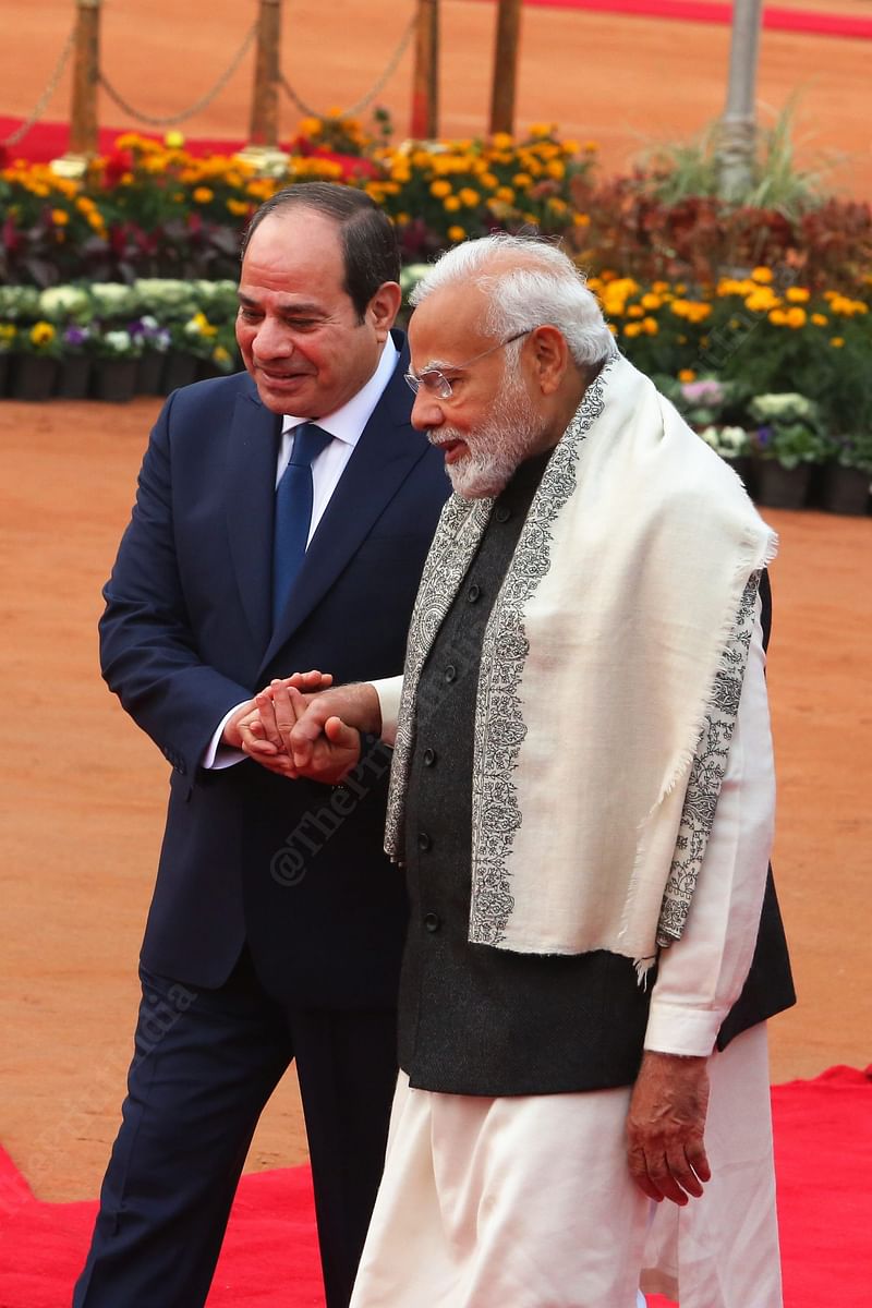President of Egypt Abdel Fattah El-Sisi, and PM Modi at hold hand as they proceed with the reception | Photo: Praveen Jain | ThePrint