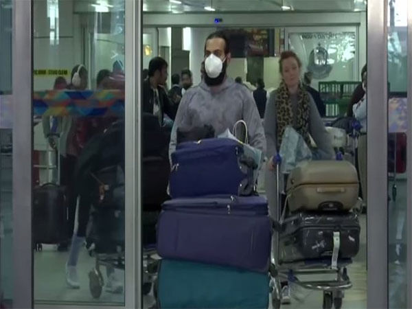 Random Covid testing continues at Delhi airport; people follow Covid appropriate behavior