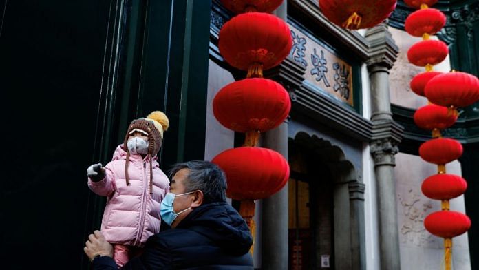 An elderly person with a child ahead of the Chinese Lunar New Year in Beijing |Representational image | Reuters/Tingshu Wang