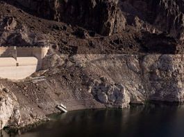 File photo of a dry spillway at Hoover Dam, and stairs ending on a cliff are seen next to the growing ring around Lake Mead, where water levels have declined dramatically to lows not seen since the reservoir was filled after the construction of Hoover Dam, as climate change and growing demand for its water shrink the Colorado River and create challenges, in Boulder City, Nevada, US | Reuters/Caitlin Ochs