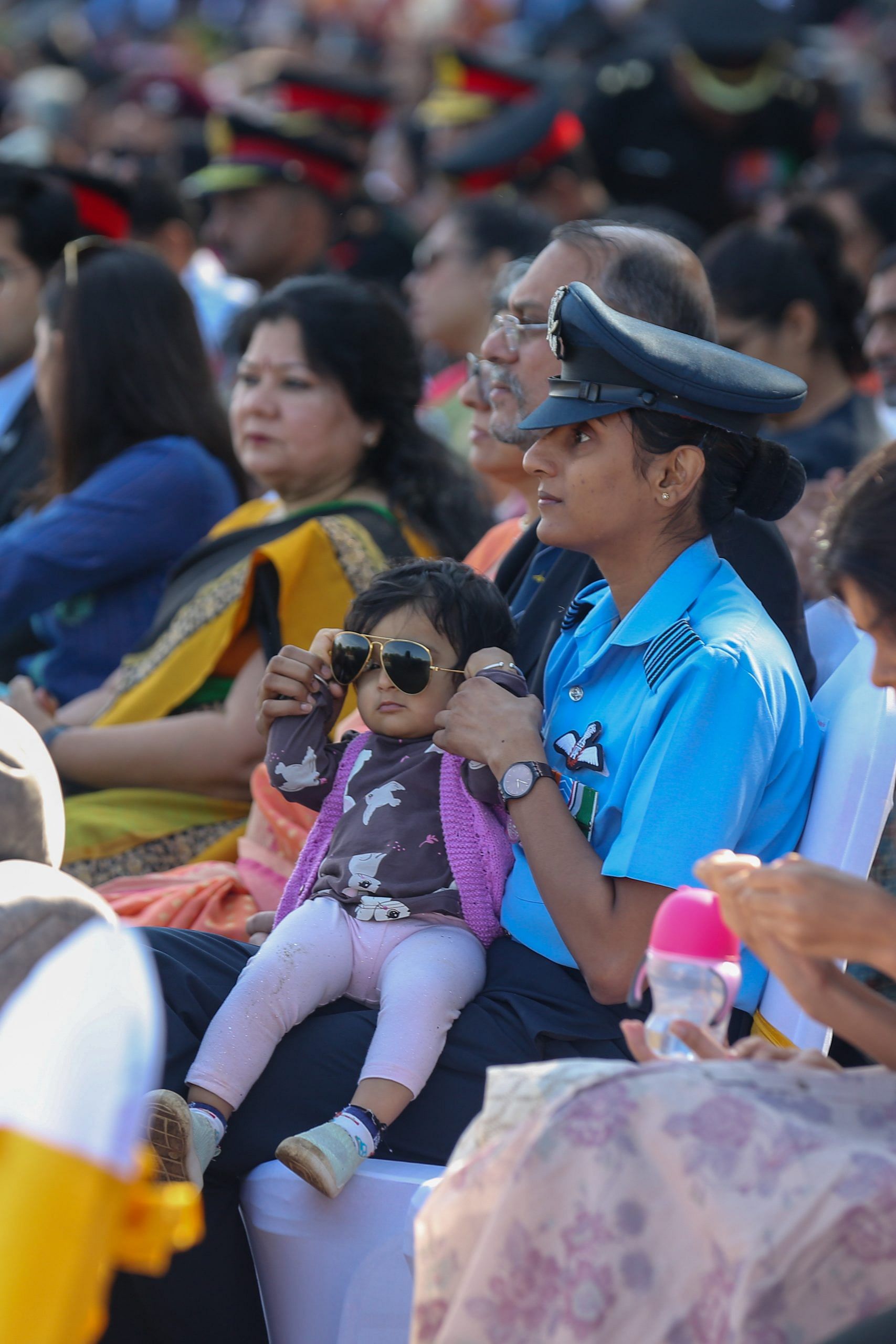 An IAF officer attending ‘Shaurya Sandhya’ with her child | Suraj Singh Bisht | ThePrint