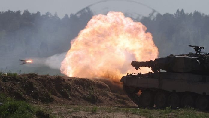 A Polish Leopard 2PL tank fires during Defender Europe 2022 military exercise of NATO troops, at the military range in Bemowo Piskie, near Orzysz, Poland 24 May 2022 | Photo: Reuters/Kacper Pempel