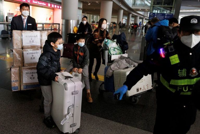 ‘Life is moving forward’: China declares new Covid phase as borders open