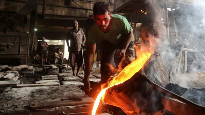 Representational photo of a worker pours molten iron from a ladle to make automobile spare parts inside an iron casting factory in Ahmedabad | Reuters 