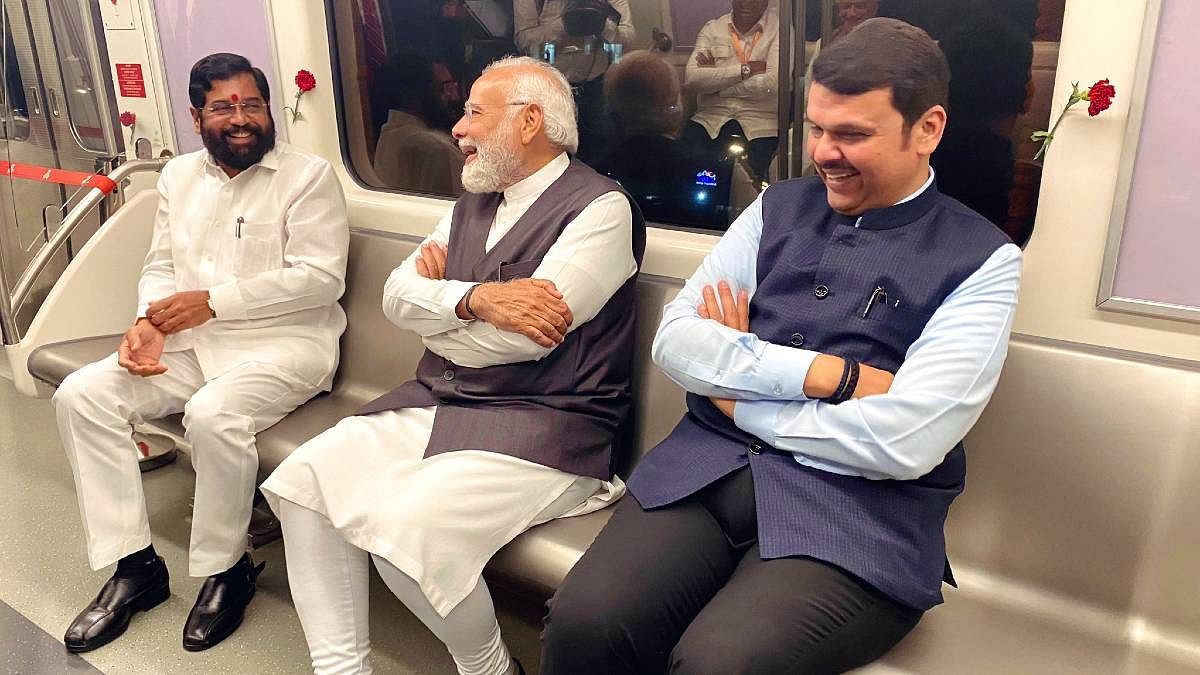 Prime Minister Narendra Modi with Maharashtra CM Eknath Shinde to his right and deputy CM Devendra Fadnavis to his left in Mumbai on Thursday | Photo: Twitter/@Dev_Fadnavis