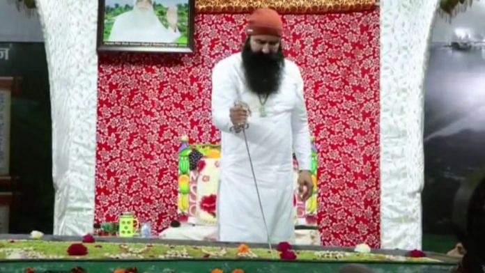 Out on parole, Dera chief Ram Rahim cuts cake with sword; video goes viral | ANI