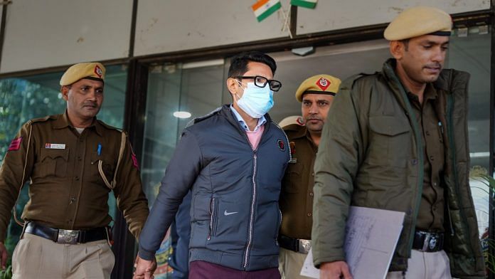 Shankar Mishra being taken away by the police from the DCP office at IGI Airport in New Delhi, on 7 January 2023 | PTI