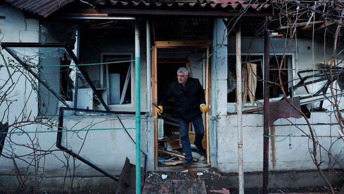A local resident checks his house after a Russian missile strike, amid Russia's attack on Ukraine, in Kyiv, Ukraine on 31 December, 2022 | Reuters