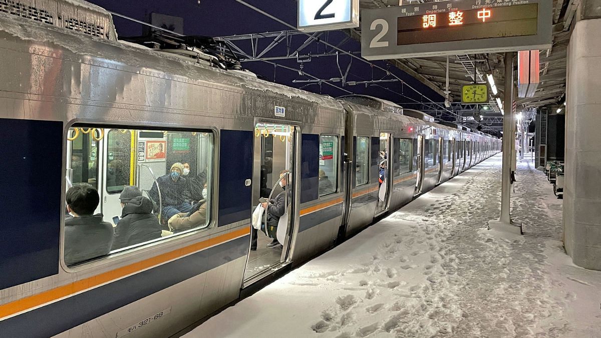 A train is stranded at Nishioji Station in Kyoto, Japan on 25 January 2023 | Kyodo/via Reuters