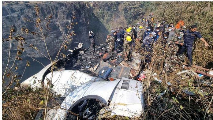 Rescue teams work to retrieve bodies at the crash site of an aircraft carrying 72 people in Pokhara in western Nepal, on 15 January 2023 | Bijay Neupane/Handout via Reuters