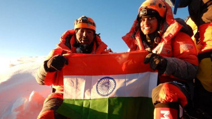Ajeet and Deeya Bajaj sitting atop Mount Everest, the highest mountain peak in the world | Credit: Ajeet Bajaj / Deeya Bajaj