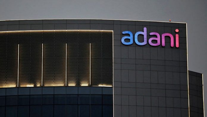 The logo of the Adani Group is seen on the facade of one of its buildings on the outskirts of Ahmedabad | Reuters file photo
