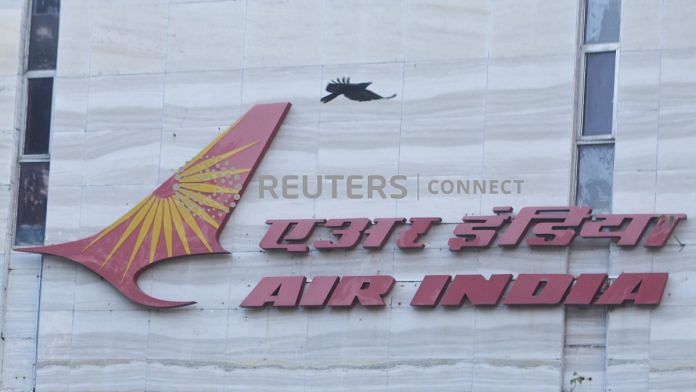A bird flies over a logo of Air India airlines at the corporate headquarters in Mumbai | Reuters file photo