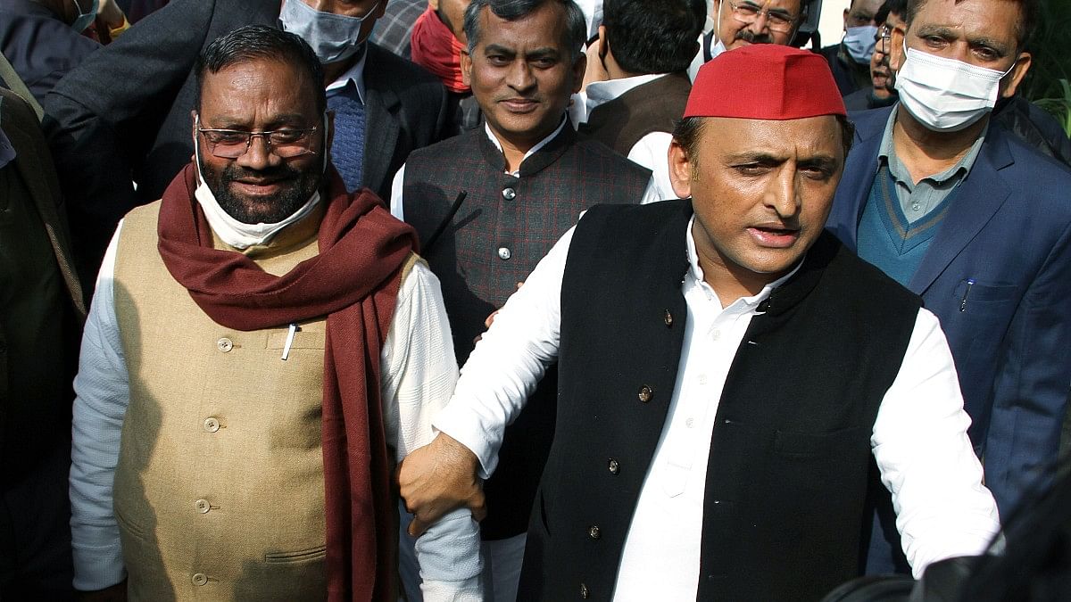 File photo of Samajwadi Party chief Akhilesh Yadav and Swami Prasad Maurya at the party office in Lucknow | ANI