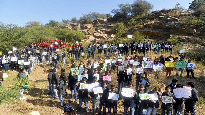 File photo of students from schools across the NCR and members of Aravali Bachao Citizens Movement participating in a campaign to save Aravalli forest, in Gurugram in December 2022. | ANI