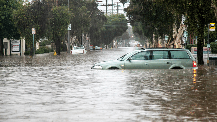 Abandoned cars are left in a flooded street in east Santa Barbara, California, U.S. 9 January, 2023 | Reuters Photo/Erica Urech