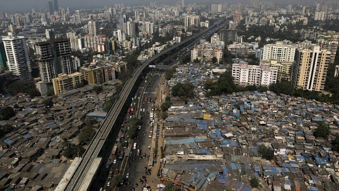 File photo of slums and high-rise buildings seen in Mumbai, India, 29 January 2021 | Reuters/Francis Mascarenhas