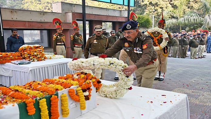 Delhi Police Commissioner Sanjay Arora pays floral tribute to slain ASI Shambhu Dayal, in New Delhi on Sunday. | ANI