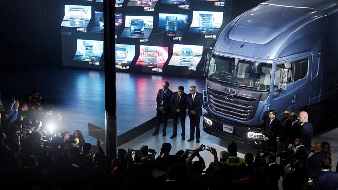 P. B. Balaji, CFO Tata Motors group, Girish Wagh, executive director of Tata Motors, and Natarajan Chandrasekaran, Chairman, Tata Motors, pose next to H.55S Hydrogen internal combustion engine truck unveiled at the Auto Expo 2023 in Greater Noida | Reuters