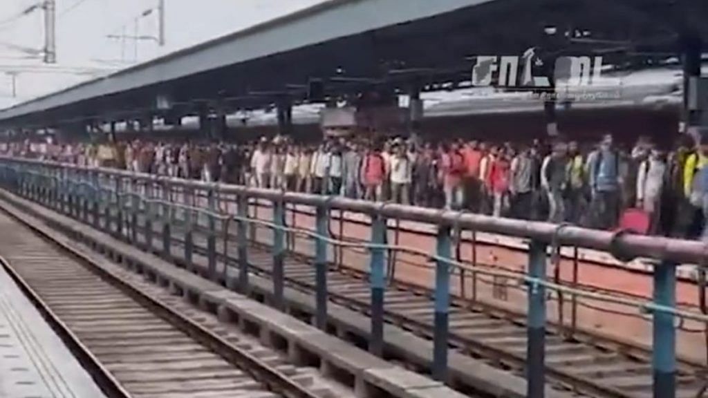 Screengrab from a YouTube video showing purported migrant workers walking down a platform at the Chennai Central Railway Station.