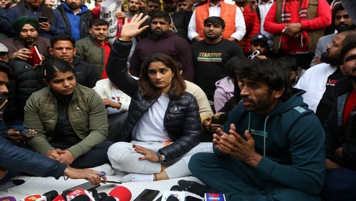 Wrestlers Vinesh Phogat and Sakshi Malik sit in protest at Jantar Mantar Wednesday. | Manisha Mondal | ThePrint