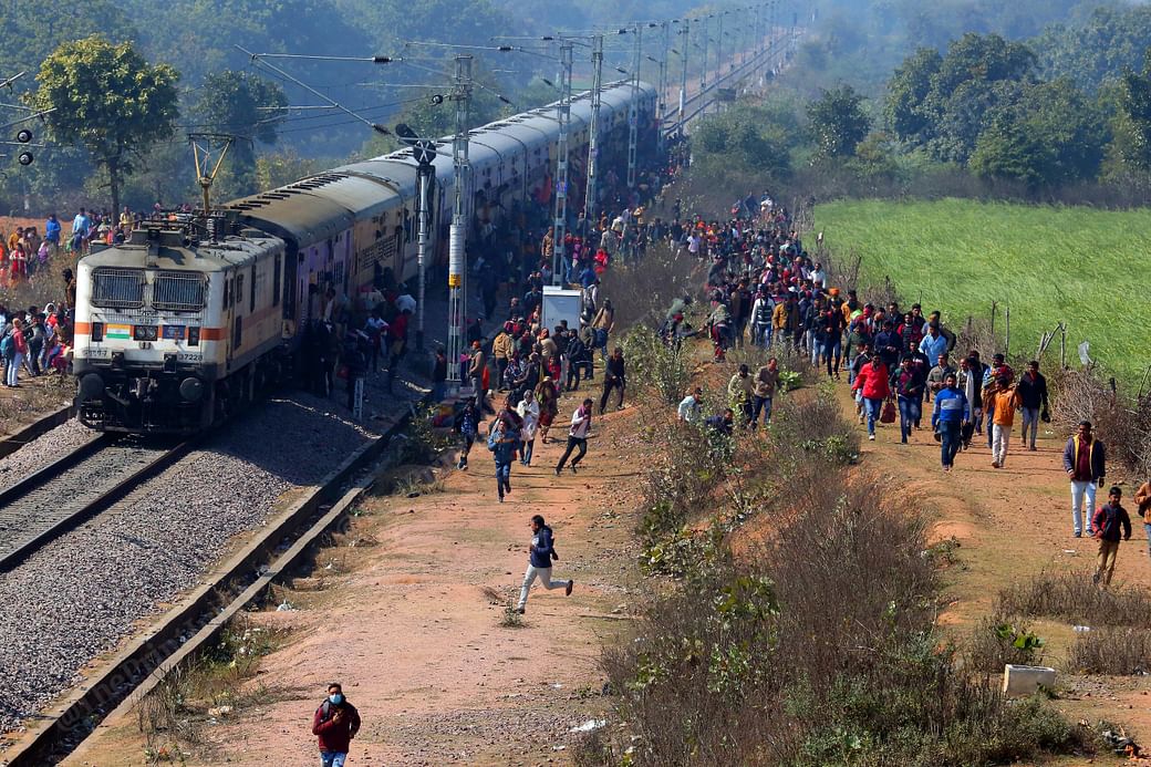 Devotees run after pulling the chain of the Bhopal - Khajuraho express at Bagashwer dham | Photo: Praveen Jain | ThePrint