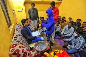 Dinesh Garg with his devotees at the Darbar at his home in Gada | Photo: Praveen Jain | ThePrint