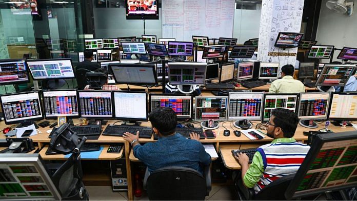 Share brokers watch stock prices on the screens as Union Finance Minister Nirmala Sitharaman presents Union Budget 2023-24, in Kolkata, on 1 February 2023 | PTI
