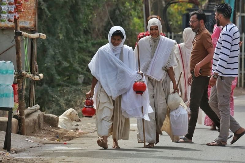 Sadhvi Pararth Rekha (right)along with Sadhvi Tatwatri Rekha, 20, on the road after collecting food (bhiksha), in Junagadh | Praveen Jain | ThePrint